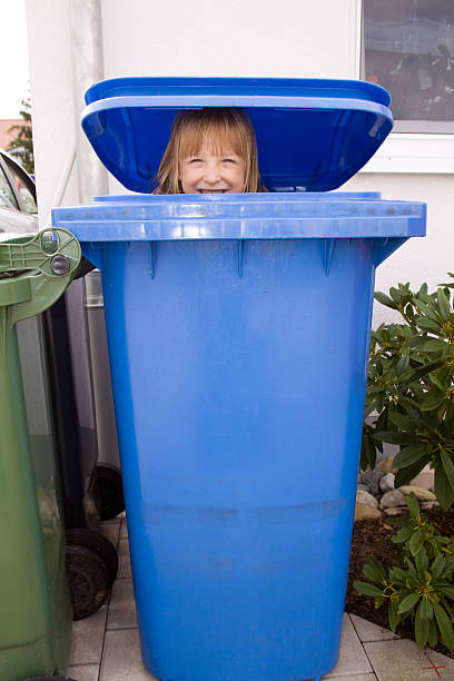 istock Smiling girl hiding in a paper container 176087109