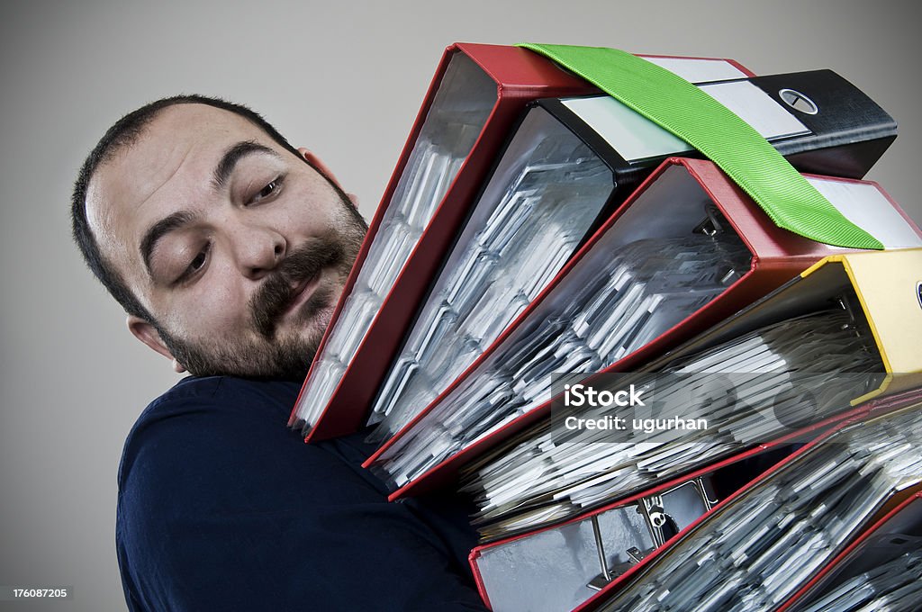 workers businessman with a stack of files. Adult Stock Photo