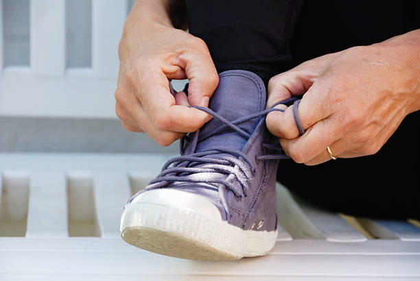 istock tying sports shoes 176087305