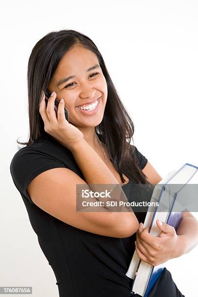 Happy College Girl Talking On Her Cell Phone Stock Photo - Download Image Now - Cut Out, Talking, 18-19 Years