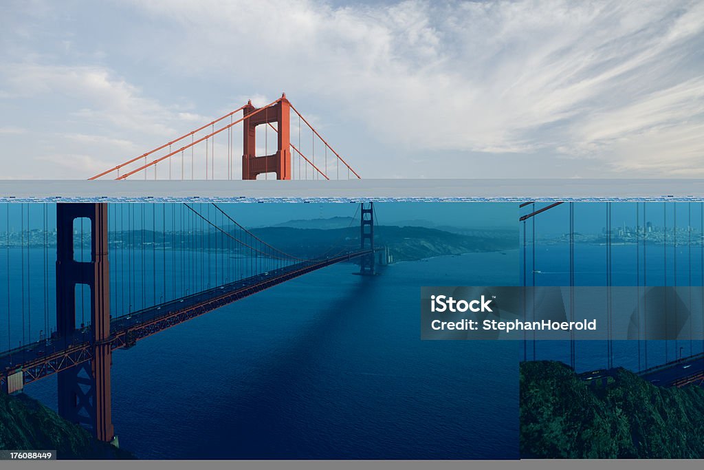 El puente Golden Gate durante la puesta de sol sobre un hazy día - Foto de stock de Agua libre de derechos