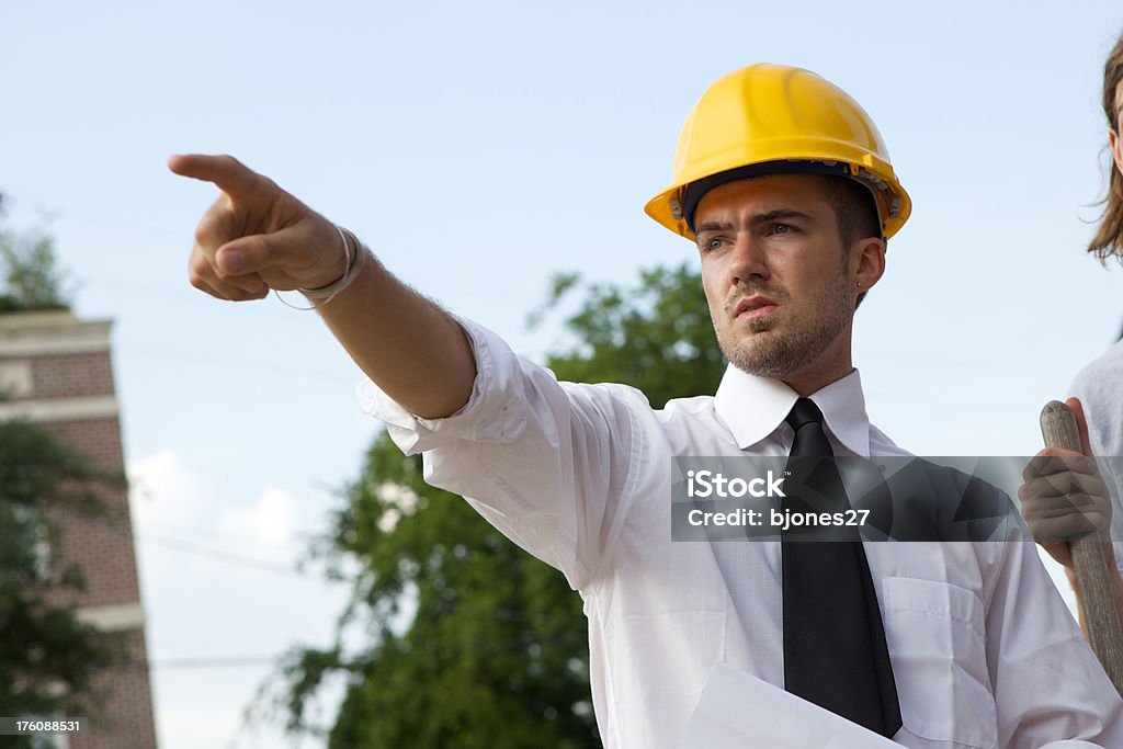 Foreman Foreman pointing at something. Adult Stock Photo