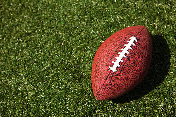 istock American football on the turf 176089305