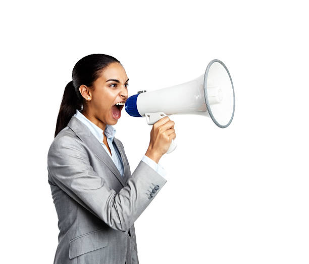 primo piano di una donna d'affari urlando nel megafono - complaining megaphone speech businesswoman foto e immagini stock