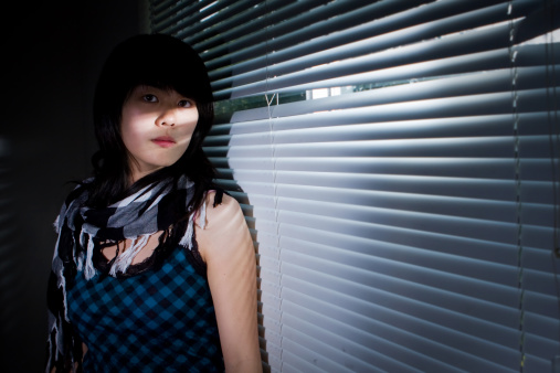 portrait of woman next to window