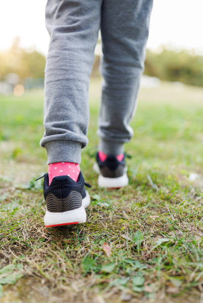 istock Little Girl Walking on Grass 1760916212