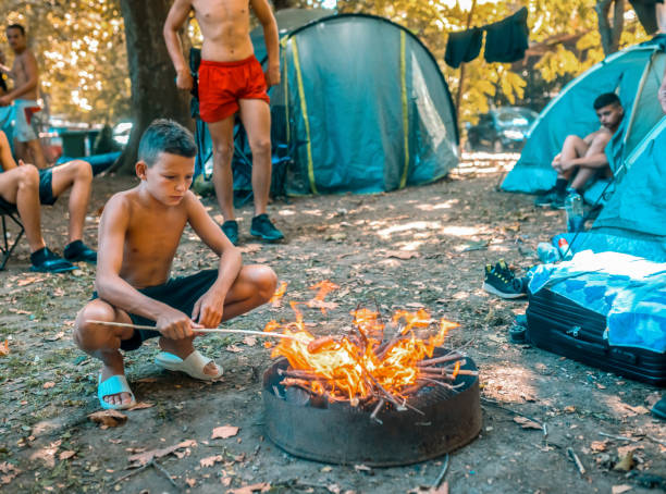 istock children in the camp are preparing a barbecue 1760923102