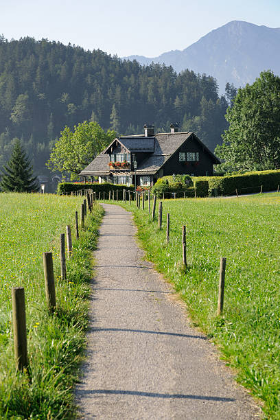Trail leading to a traditional austrian house (XXXL)