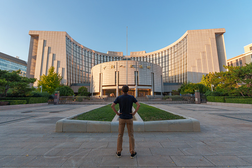 Men Standing on people's Bank of China