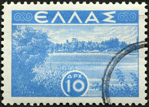 distant city on a hill on an old Greek stamp.