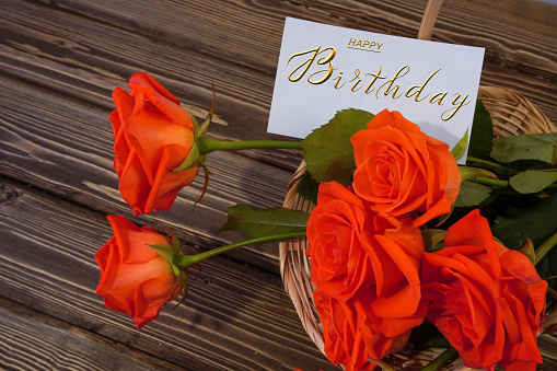 postcard , Internet banner  with a birthday greeting, with the inscription - happy birthday, a bouquet of flowers with a note of congratulations, roses
