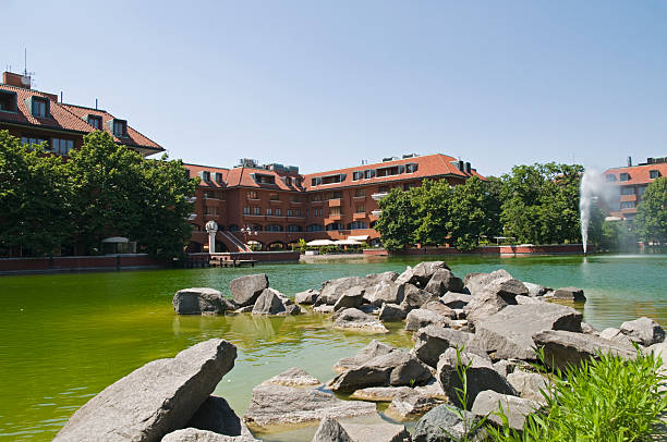 istock Rocks and lake, residential town 176094354