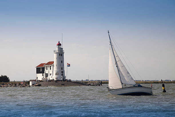 istock Sailboat rounding buoy near Lighthouse (XXL) 176094603