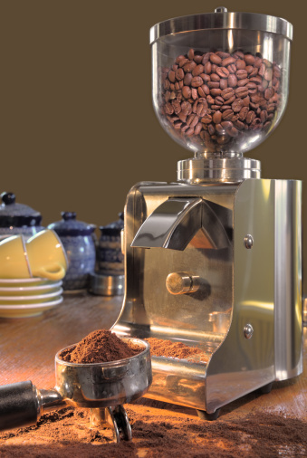 Modern coffee grinder and kitchen utensils.
