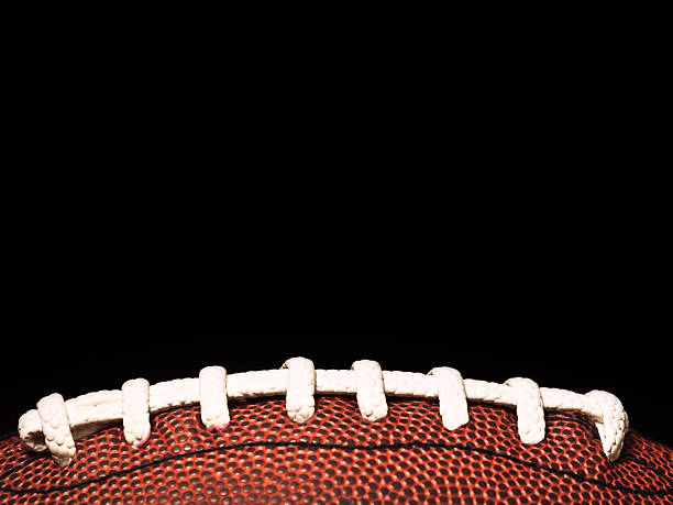 istock American football on black 176095290