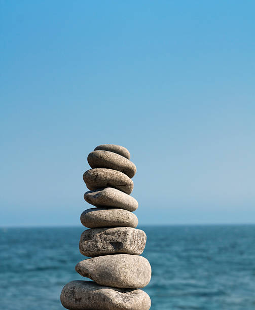 istock Stacked Stone Pebbles, Water, and Sky 176095599