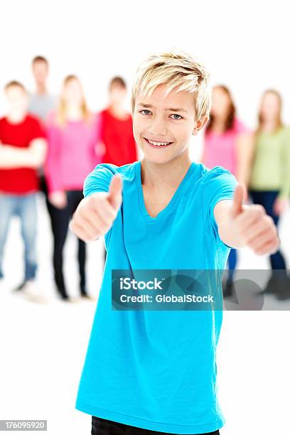 Happy Teenage Boy Showing Success Sign Stock Photo - Download Image Now - 14-15 Years, Adult Student, Casual Clothing