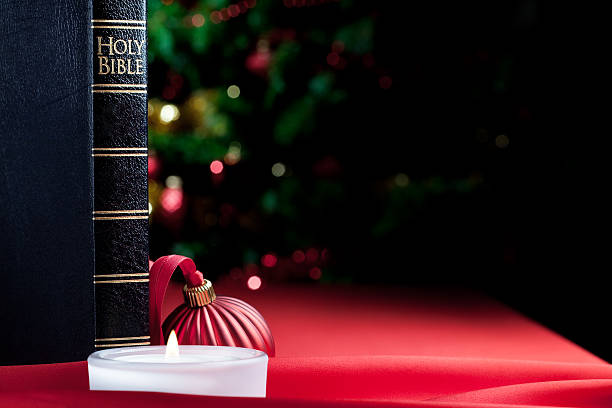 istock Bible, candle light and defocused lights 176096059