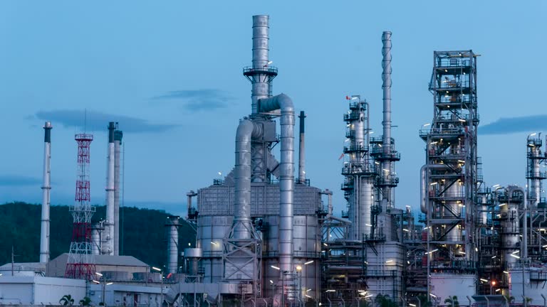 Oil refinery gas petrol plant industry with crude tank, gasoline supply and chemical factory. Petroleum barrel fuel heavy industry oil refinery manufacturing factory plant. Refinery industry blue sky