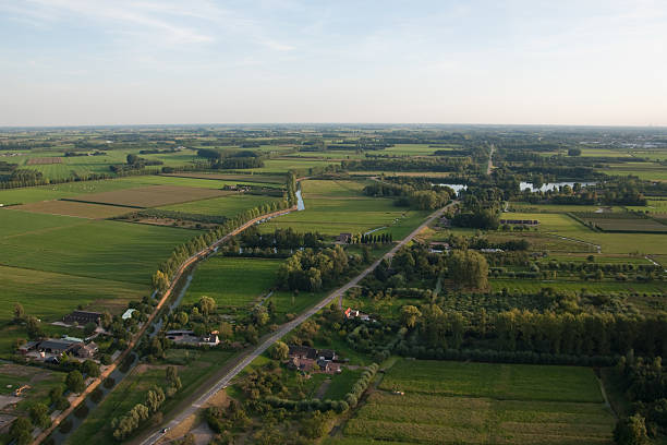 istock Aerial view over a countryside by evening light 176097651