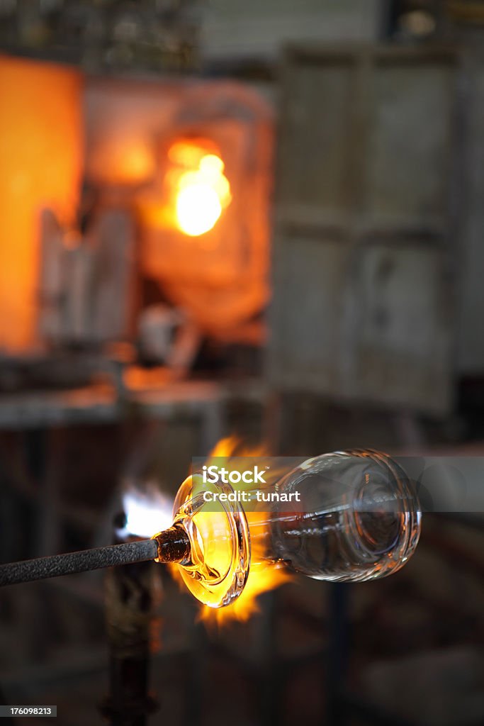 Glass Factory Shaping a glass in a glass factory Art And Craft Stock Photo