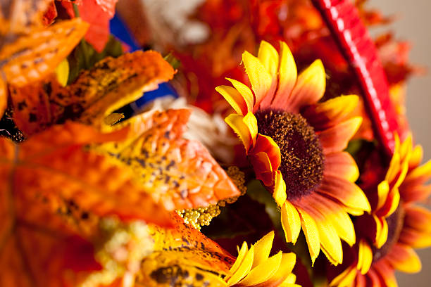 istock Basket of fall leaves and sunflowers. 176099246