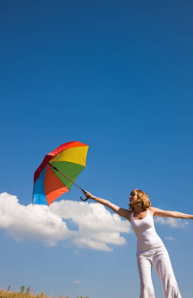 istock woman and a color umbrella 176099748