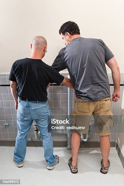 Two Men At The Bathroom Urinals Stock Photo - Download Image Now - Penis, Measuring, Men