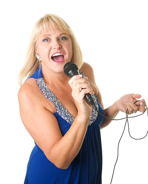 istock Beautiful Woman In Gown Singing into a Microphone 176100244