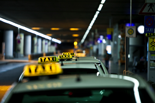 Four Taxis waiting for business at Taxi Stand
