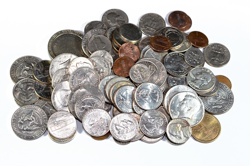 Pile of American coins of different times and values, 1 cents, dimes, quarters, half dollars, and dollars, vintage retro old United States of America coins, exchange rate, economy concept, USA coins, selective focus