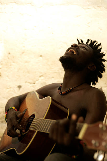 istock Laughing man playing the guitar, creating African music 176101017
