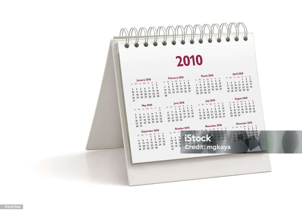Desktop Calendar: Year 2010 A spiral bound desktop calendar: Year 2010. Isolated on white background. 2010 Stock Photo