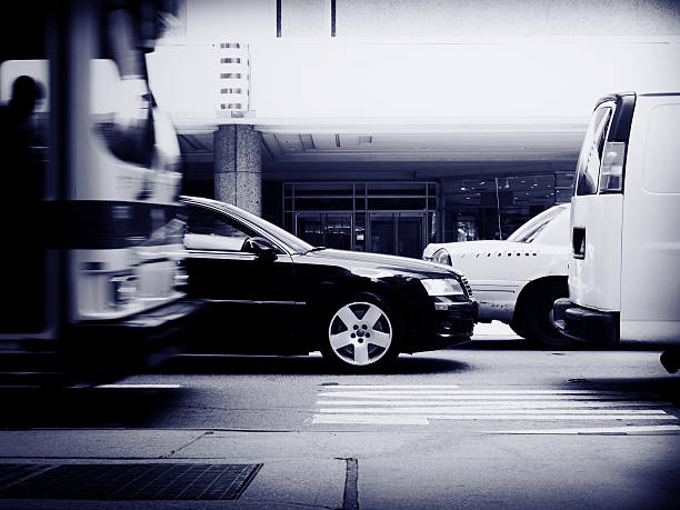 Urban Street Traffic Jam Urban Street Traffic Jam. Cars and Yellow Cabs stuck in the Traffic Jam. Sideview. Motion blurred Bus and Truck. Long Time Exposure. Black & White. Toned. car city urban scene commuter stock pictures, royalty-free photos & images