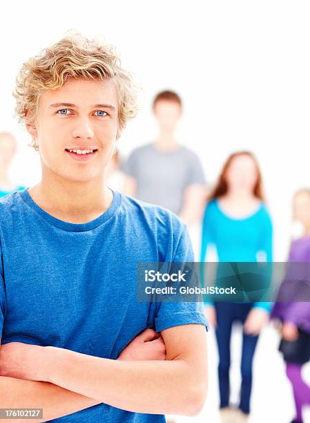 Closeup Of A Confident Teenage Boy With Hands Folded Stock Photo - Download Image Now