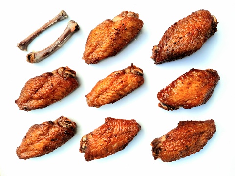 Deep Fried Chicken Wings and Bones - white background.