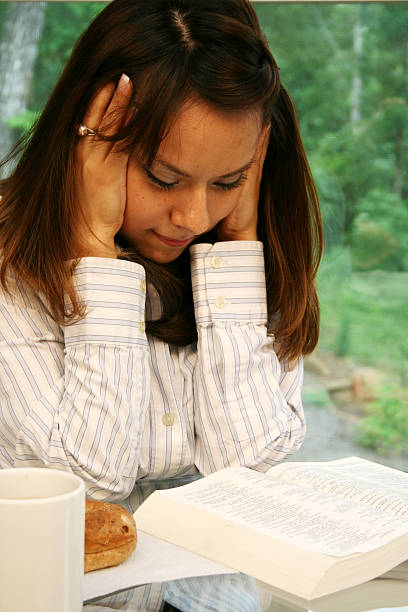 istock Young Hispanic Woman Reading A Book 176103225