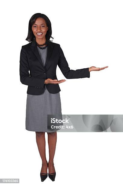 Businesswoman Presenting To Her Left Stock Photo - Download Image Now - Adult, Adults Only, African Ethnicity