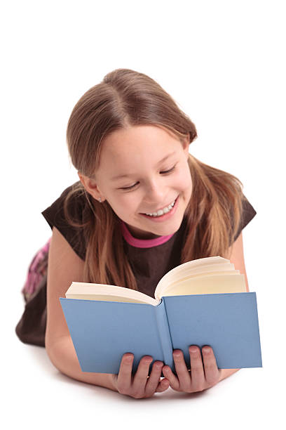istock ten years old girl reading a book 176103793
