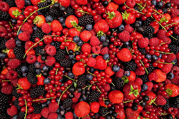 plenty of fresh mixed berries stock photo