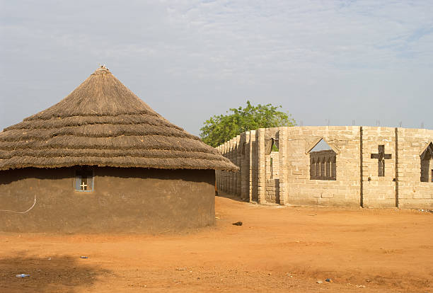 Church Construction in Sudan "A partially completed Christian church under construction, next to the original mud and grass roofed building, in Southern Sudan, Africa.Similar Images:" south sudan stock pictures, royalty-free photos & images
