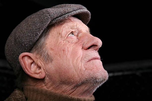 istock Elderly Man Looking Up for Spiritual Help 176105793