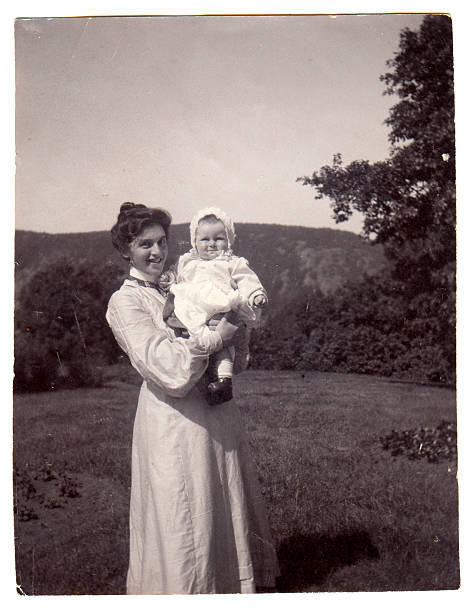 Edwardian Victorian Mother and baby Vintage photograph of a young mother with her baby from the late Victorian early Edwardian period. edwardian style photos stock pictures, royalty-free photos & images