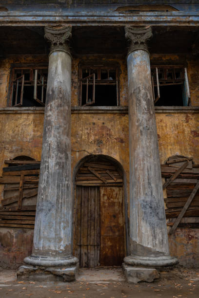 istock Old abandoned building with columns on a cloudy day 1761089337