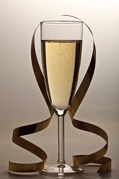 istock Champagne flute and golden streamer 176108970