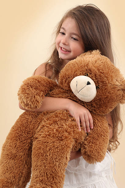 istock Little Girl And Teddy Bear 176109051