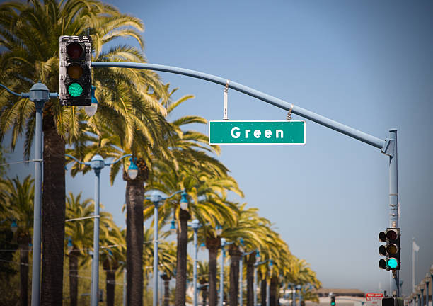 istock Green stop light and road sign. 176109172