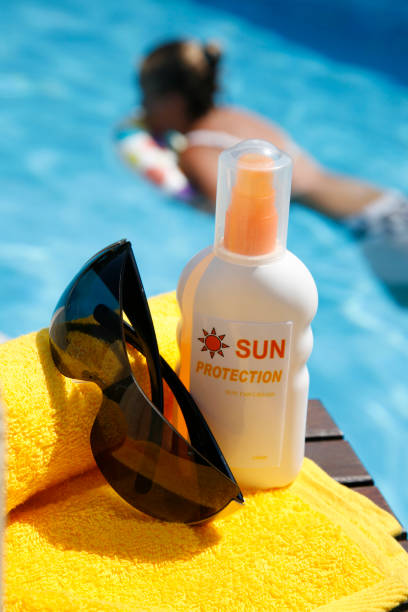 istock Sun Lotion by a Swimming Pool 176109467