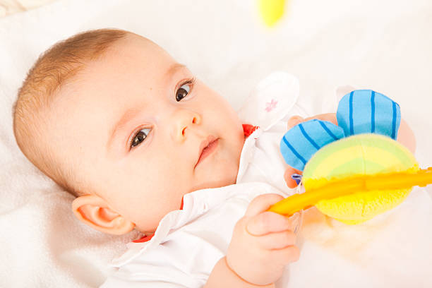 istock baby girl looking at camera 176109501