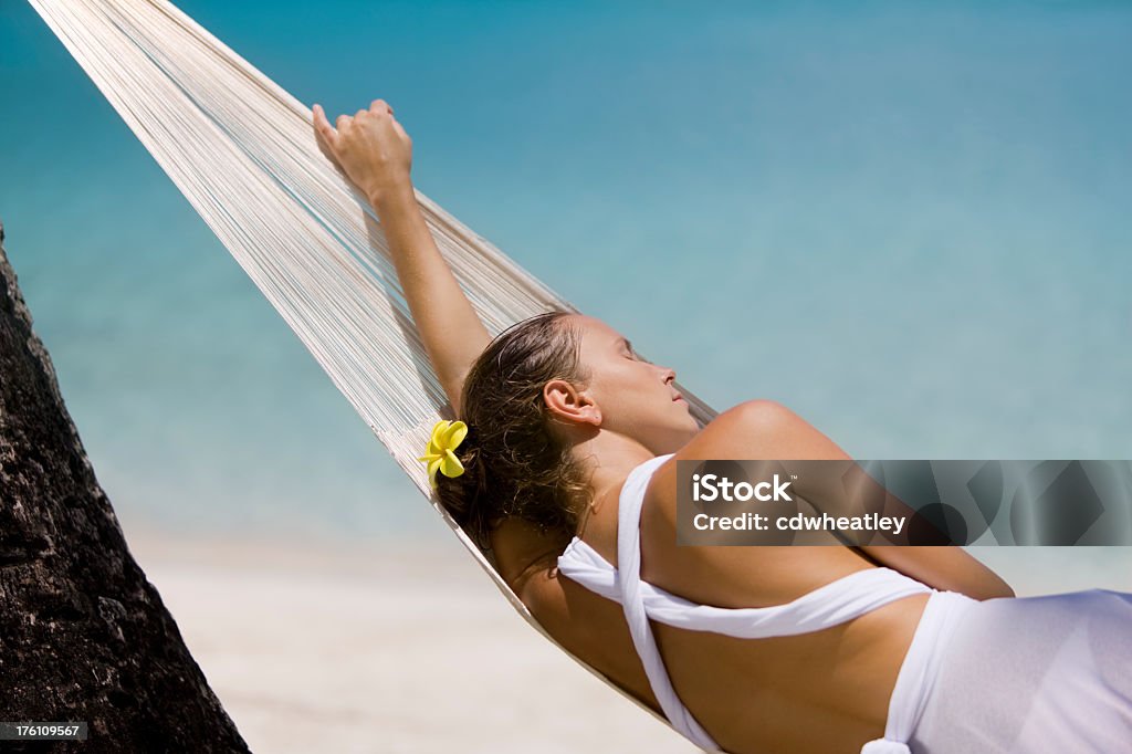 woman sleeping in the hammock woman sleeping in the hammock at the beach Caribbean Stock Photo